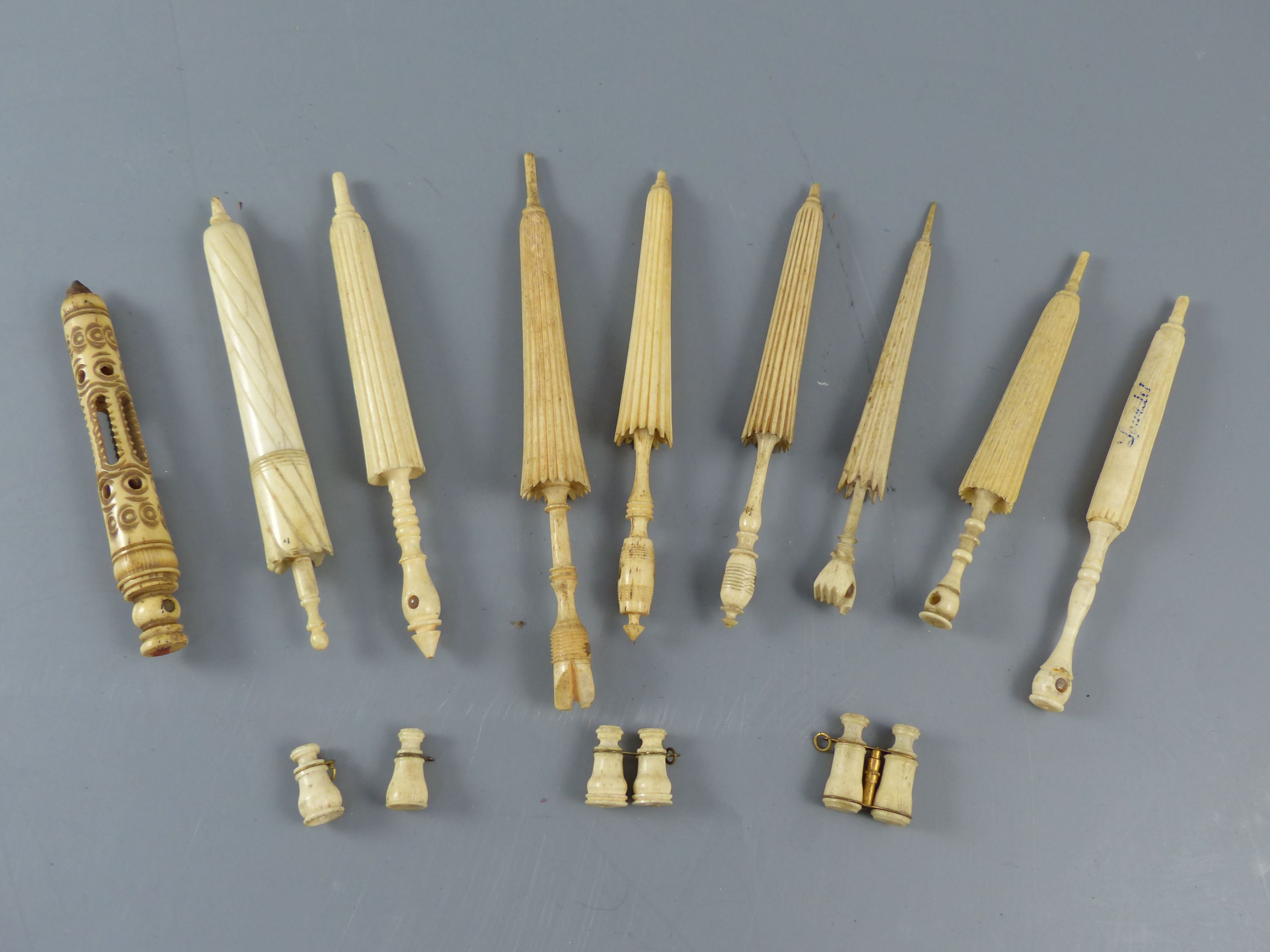 A collection of 19th century turned ivory and bone needle cases